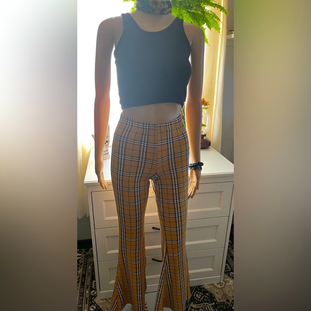 Eye Candy Small Stretchy HOT bell bottom pants. The booty….